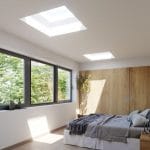 White bedroom with a wooden built-in closet and two skylight panels